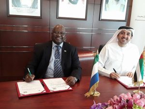 Amb.-Timbo-and-UAE-Economy-minister-smiling-after-signing-agreement.