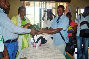 The Mayor of Kenema city, Esther G. Kaisamba presenting Cameras